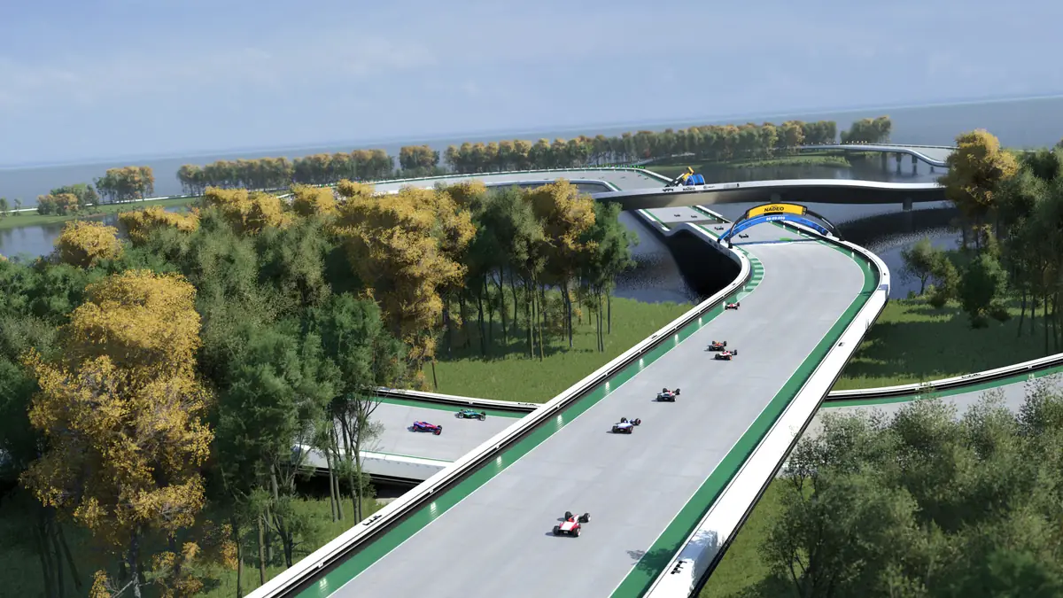 Trackmania: vista aérea de uma pista larga a atravessar uma zona verde junto à água, com vários carros em prova